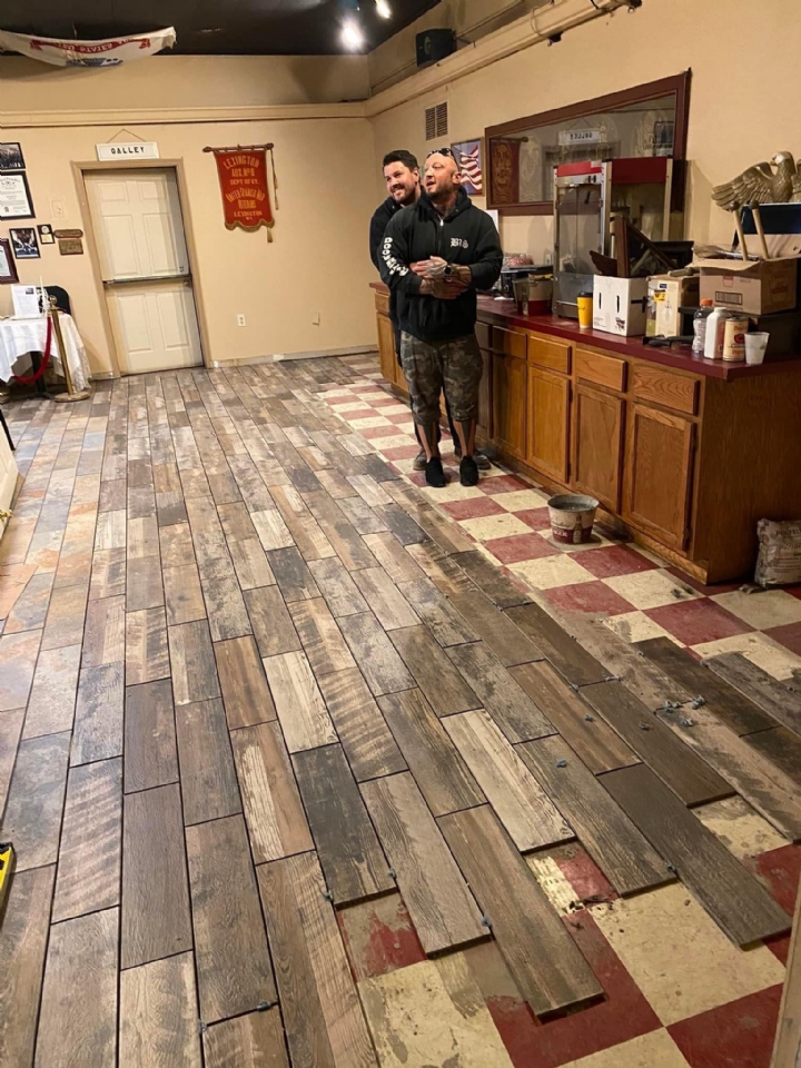 Here members of the local prison guard union finish up the tile in our mess hall. 